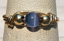 Sterling Silver Wire Wrapped Ring with Purple Cat's Eye