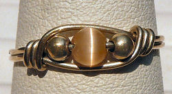 Sterling Silver Wire Wrapped Ring with Gold Cat's Eye